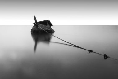 Lonely Boat On Still Water