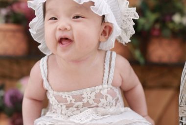 Smiling Baby With Bonnet